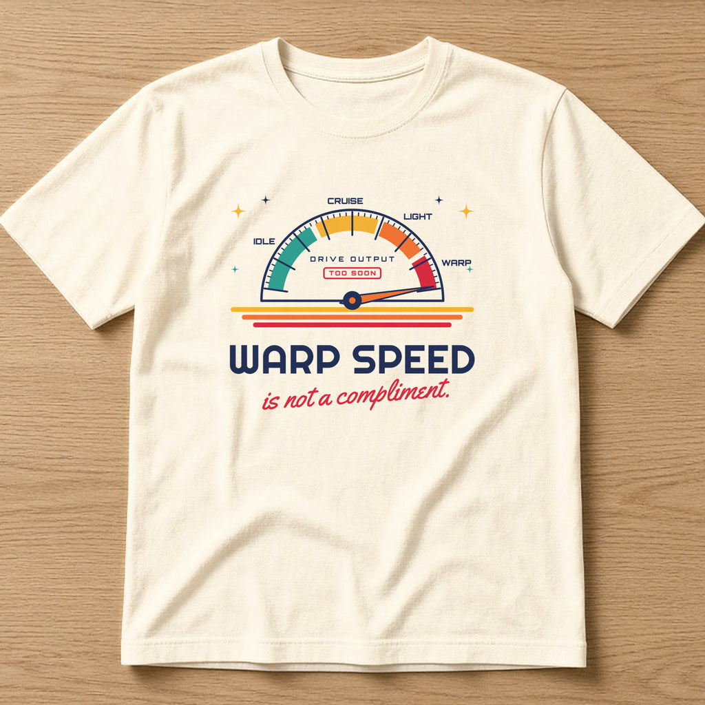 Natural t-shirt, flat lay, printed with 'Warp speed is not a compliment.'