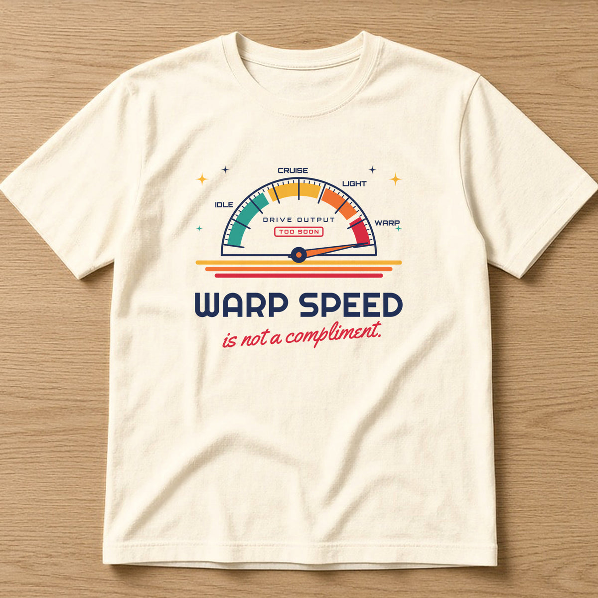 Natural t-shirt, flat lay, printed with 'Warp speed is not a compliment.'