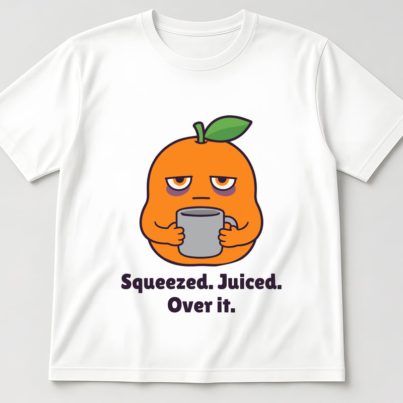White t-shirt, flat lay, printed with a tired orange holding a mug and the words 'Squeezed. Juiced. Over it.'