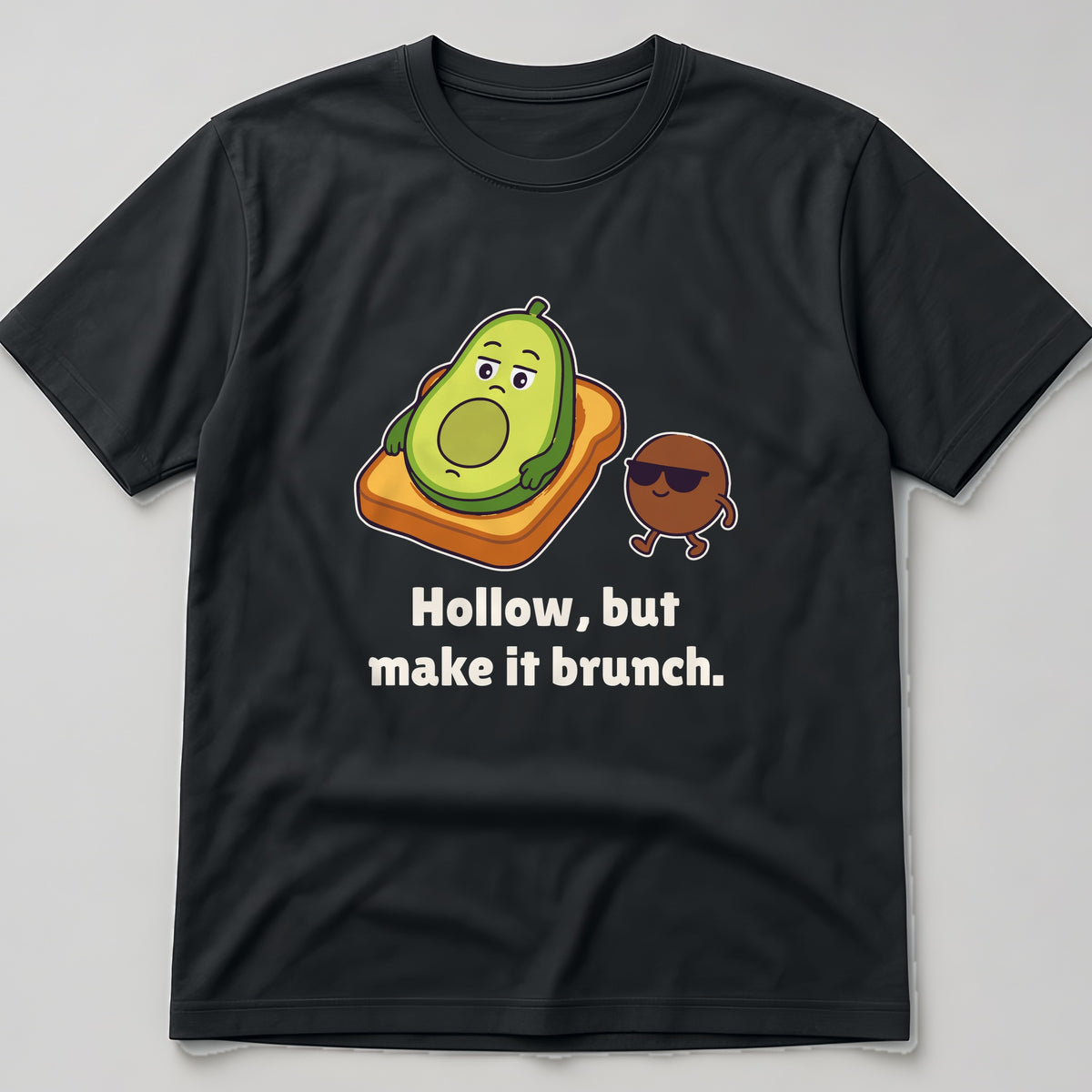 The Existential Avocado Tee in black, flat lay