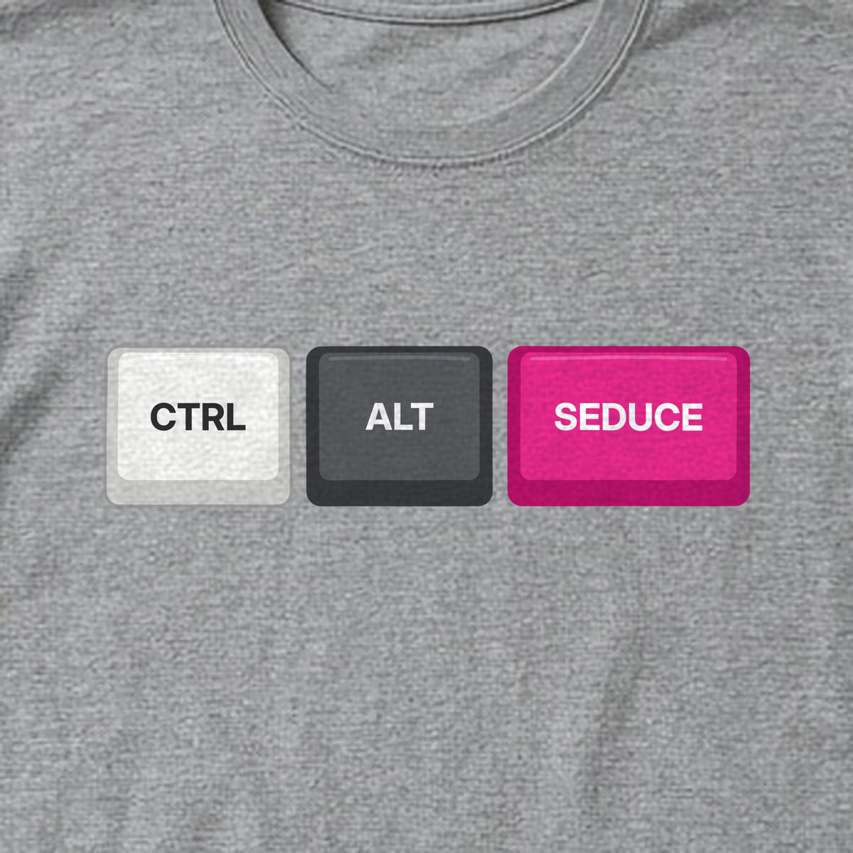Close-up of the Ctrl Alt Seduce keycaps print on a sport grey t-shirt