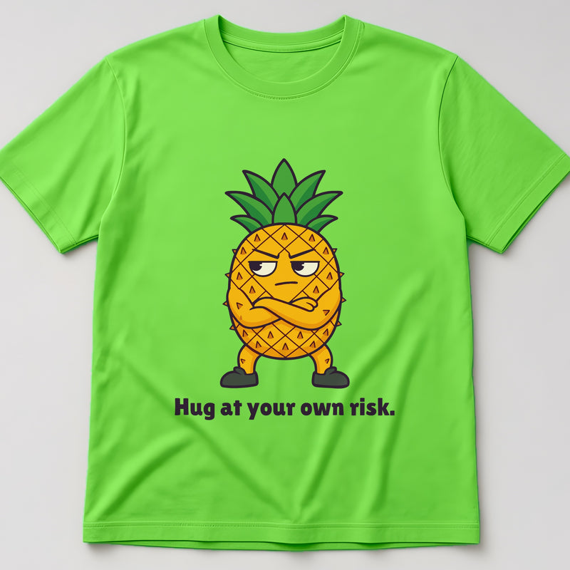 Lime t-shirt, flat lay, printed with a pineapple with its arms crossed and the words 'Hug at your own risk.'