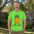 Man with salt-and-pepper hair and a grey beard wearing the lime green Pineapple With Boundaries tee in a backyard