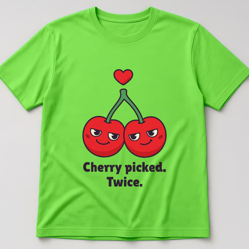 Lime t-shirt, flat lay, printed with two smiling cherries on one stem under a small heart and the words 'Cherry picked. Twice.'