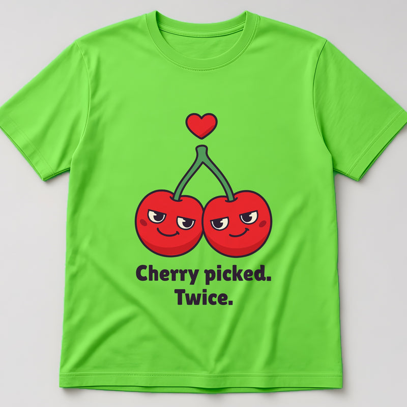 Lime t-shirt, flat lay, printed with two smiling cherries on one stem under a small heart and the words 'Cherry picked. Twice.'