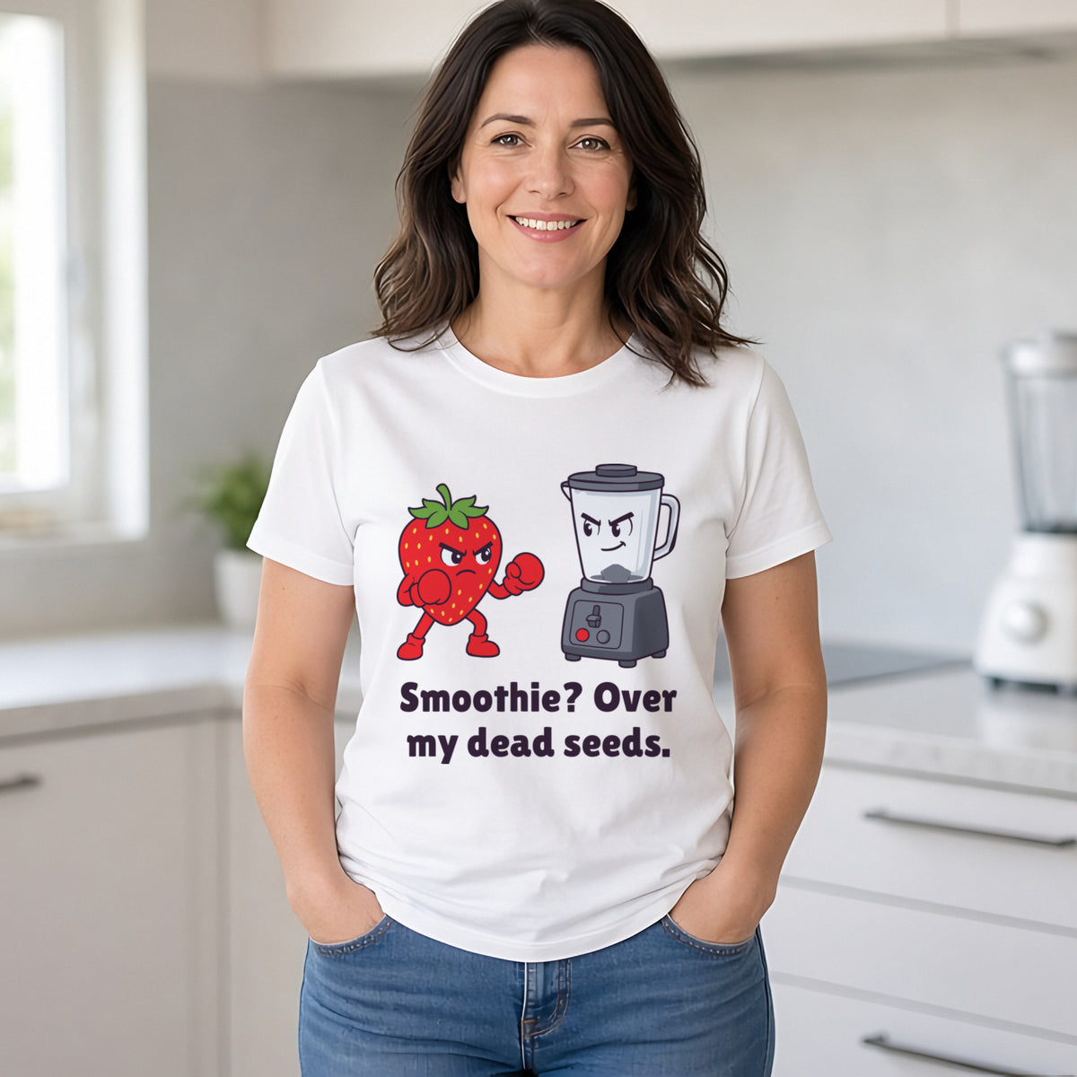 Woman with wavy brunette hair wearing the white Strawberry vs the Blender tee in a bright kitchen