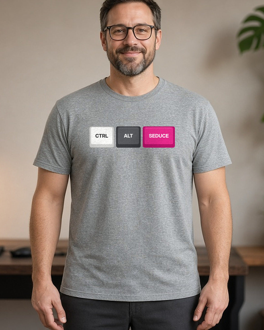 Man wearing a sport grey t-shirt printed with Ctrl Alt Seduce keycaps (spicy version) (4:5 crop). Model image is digitally generated. The print shown is the actual design; colours and fit may vary slightly, see size chart.