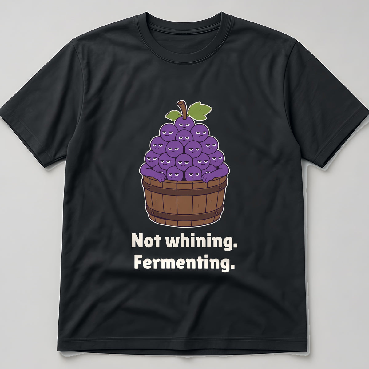 The Grumpy Grapes Tee in black, flat lay
