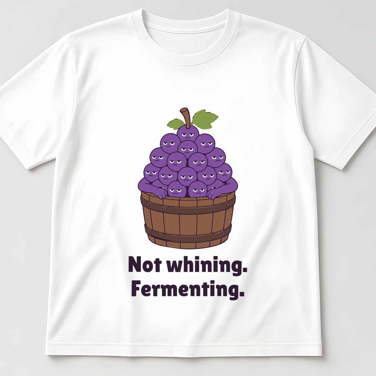 The Grumpy Grapes Tee in white, flat lay