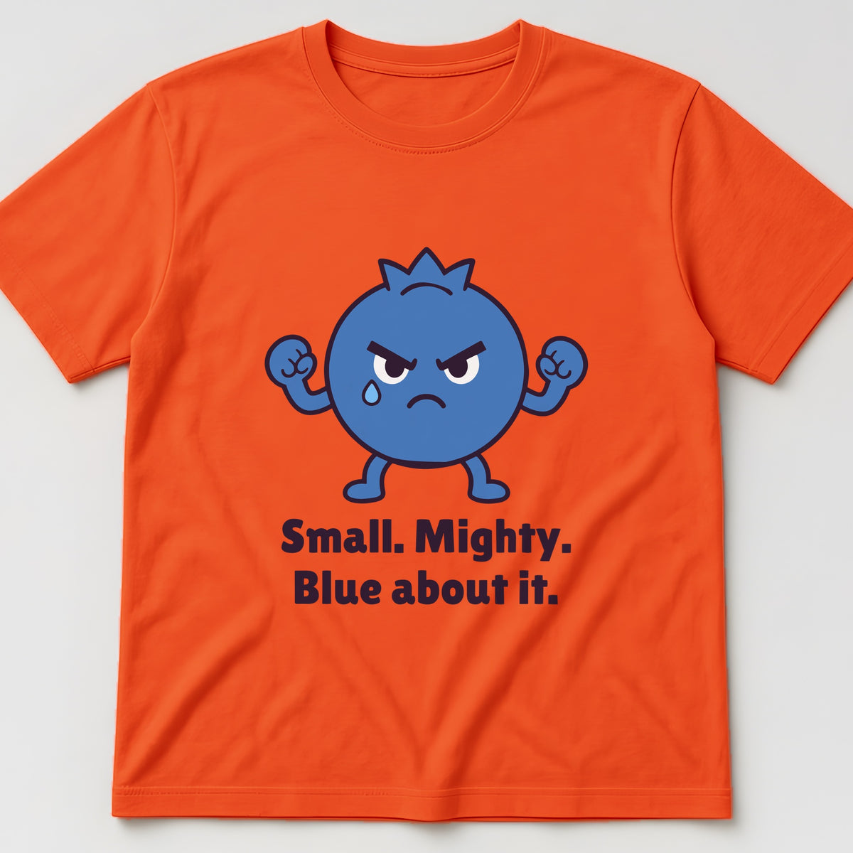 The Tiny Blueberry Tee in orange, flat lay