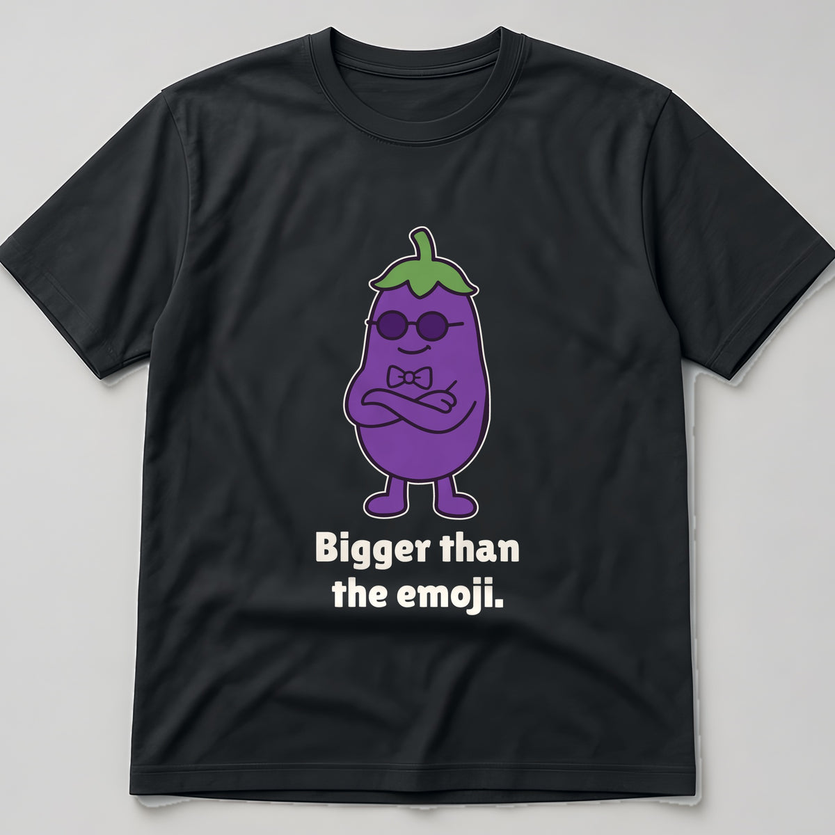 The Smug Eggplant Tee in black, flat lay