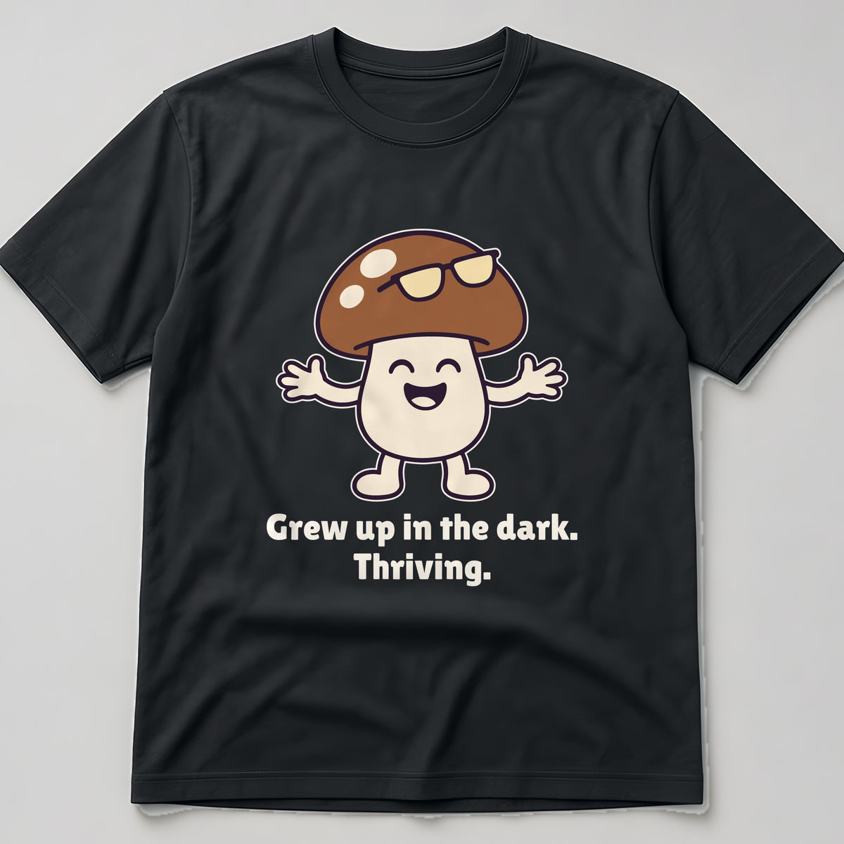 The Late-Bloomer Mushroom Tee in black, flat lay