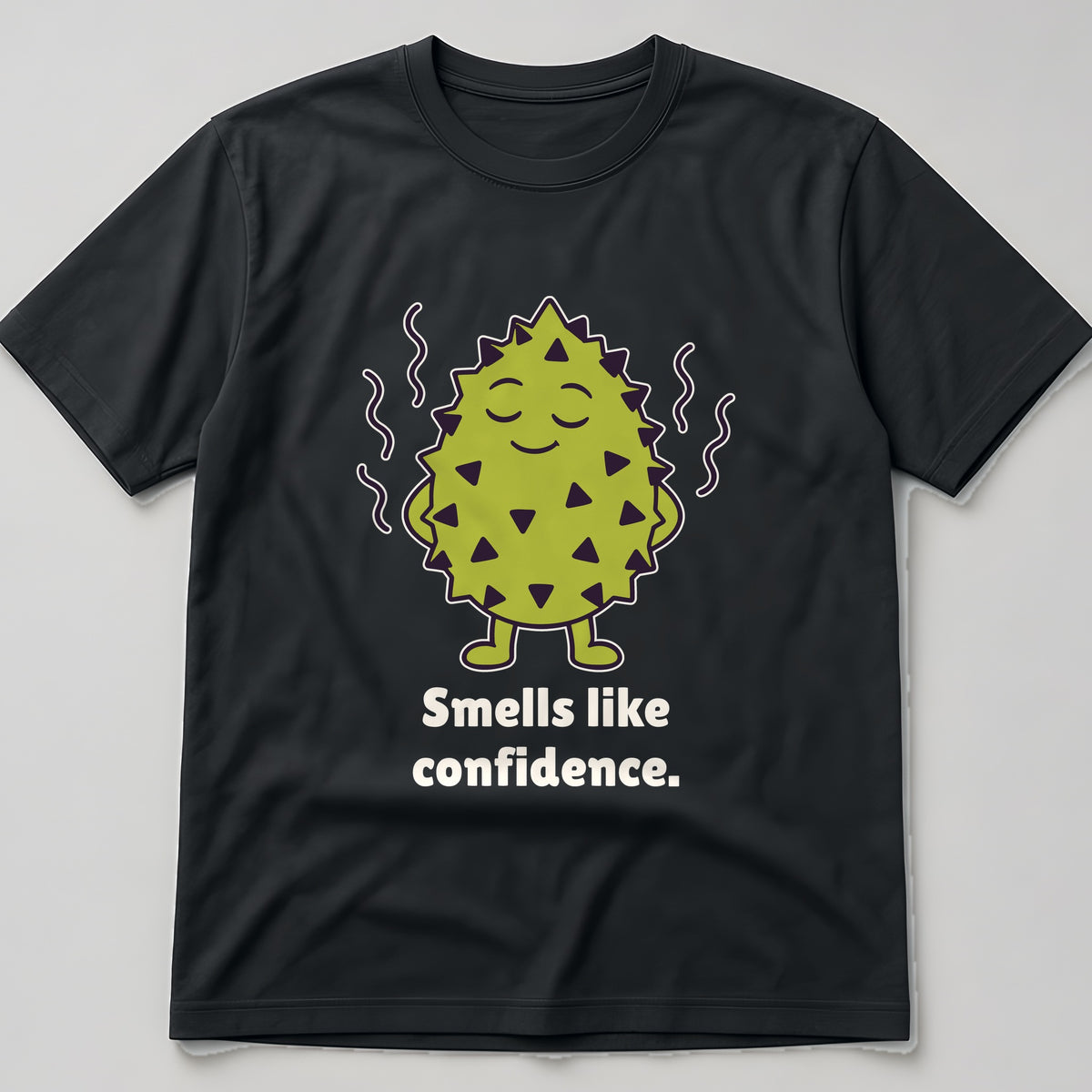 The Unbothered Durian Tee in black, flat lay