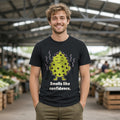The Unbothered Durian Tee – Black worn by a model