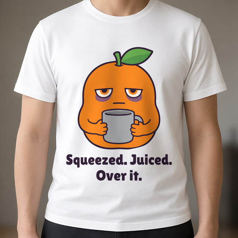 Close-up of the print on the white Squeezed Orange tee: a tired orange holding a mug above the words 'Squeezed. Juiced. Over it.'