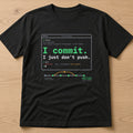 Black t-shirt, flat lay, printed with 'I commit. I just don't push.'