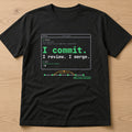 Black t-shirt, flat lay, printed with the clean version: 'I commit. I review. I merge.'