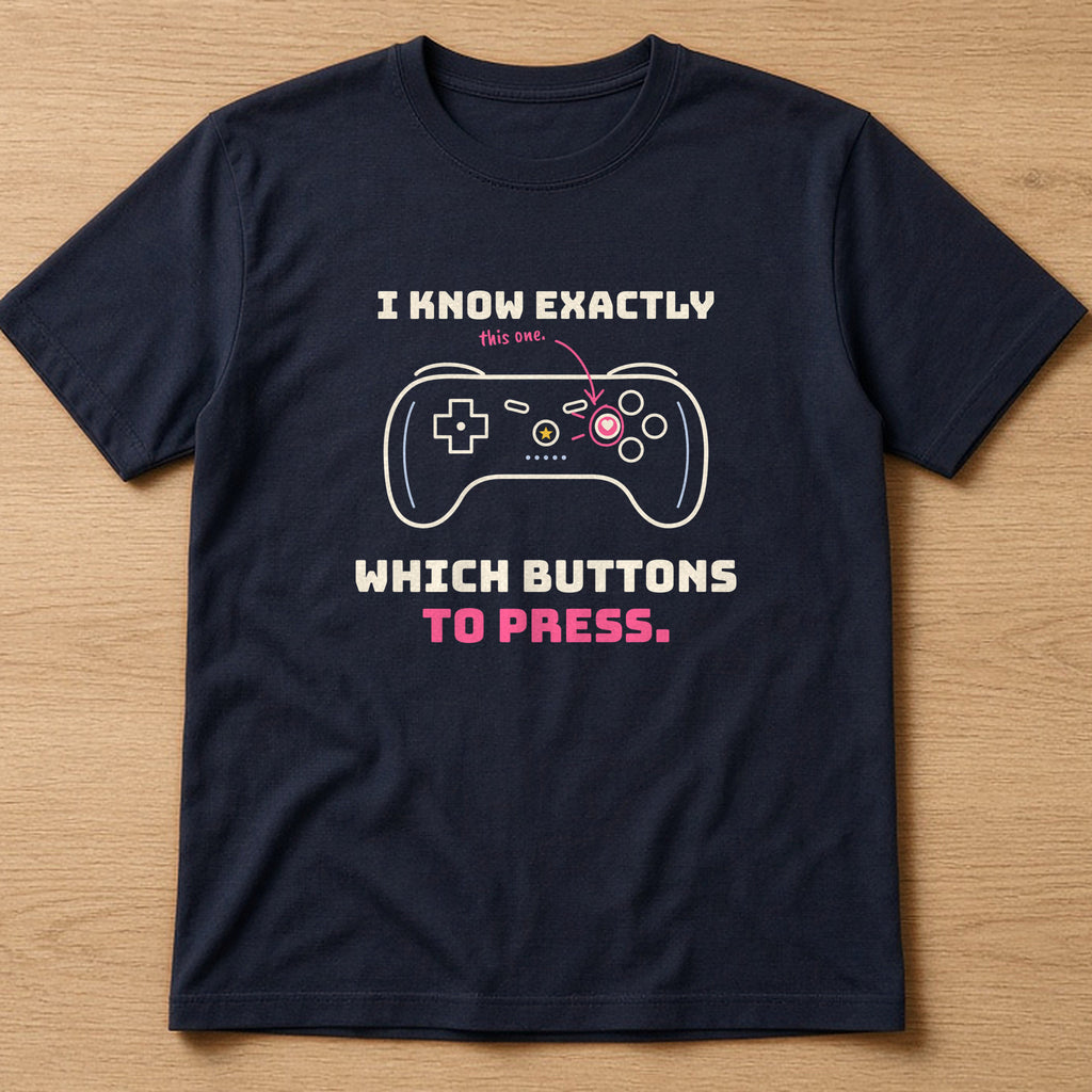 Navy t-shirt, flat lay, printed with 'I know exactly which buttons to press.'