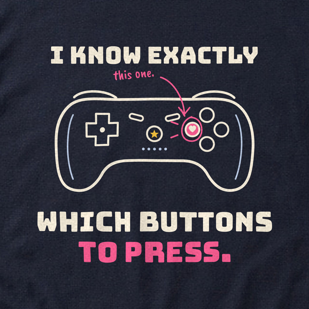 Close-up of the 'I know exactly which buttons to press.' print on a navy t-shirt