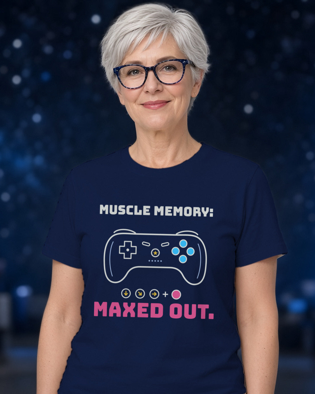 Woman wearing a navy t-shirt printed with 'Muscle memory: maxed out.' (clean version), at a sci-fi convention (4:5 crop). Colours and fit may vary slightly, see size chart.