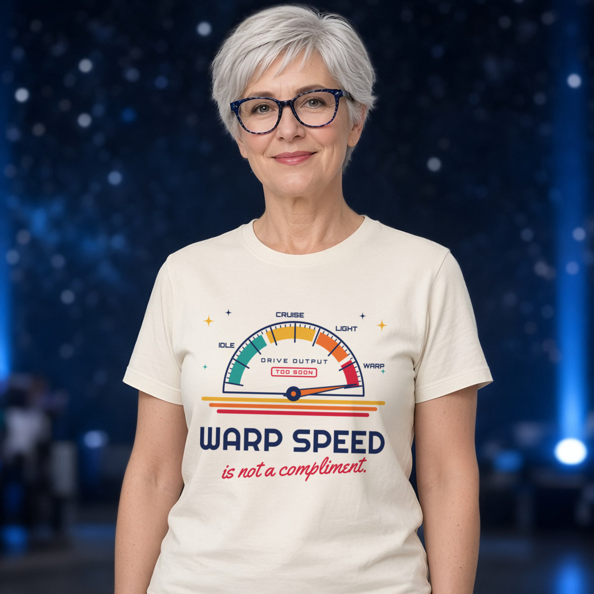 Woman wearing a natural t-shirt printed with 'Warp speed is not a compliment.' (Spicy version), at a sci-fi convention. Model image is digitally generated. The print shown is the actual design; colours and fit may vary slightly, see size chart.
