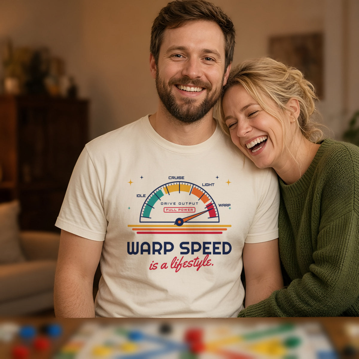 Man wearing a natural t-shirt printed with 'Warp speed is a lifestyle.' (clean version), at a board game night. Model image is digitally generated. The print shown is the actual design; colours and fit may vary slightly, see size chart.