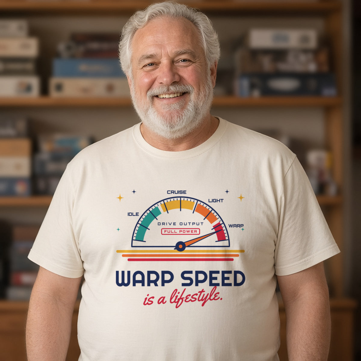 Man wearing a natural t-shirt printed with 'Warp speed is a lifestyle.' (clean version), in a living room. Model image is digitally generated. The print shown is the actual design; colours and fit may vary slightly, see size chart.