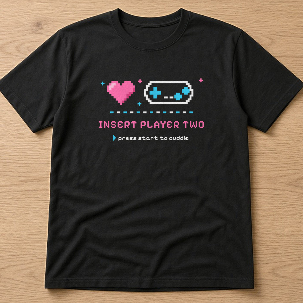 Black t-shirt, flat lay, printed with 'Insert Player Two / press start to cuddle'