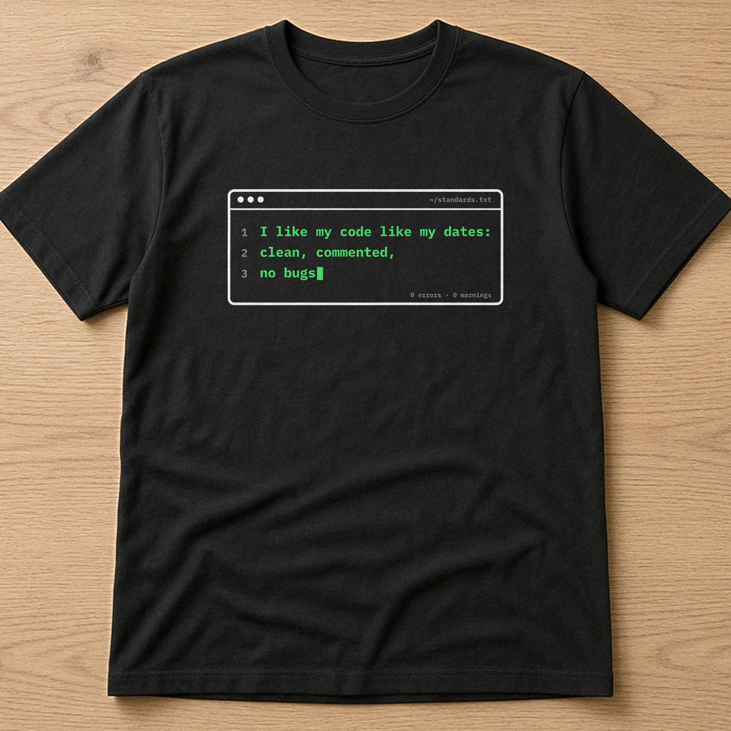 Black t-shirt, flat lay, printed with 'I like my code like my dates: clean, commented, no bugs'