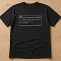 Black t-shirt, flat lay, printed with 'I like my code like my dates: clean, commented, no bugs'