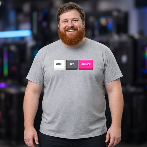 Man wearing a sport grey t-shirt printed with Ctrl Alt Seduce keycaps (Spicy version), at a fan convention. Model image is digitally generated. The print shown is the actual design; colours and fit may vary slightly, see size chart.